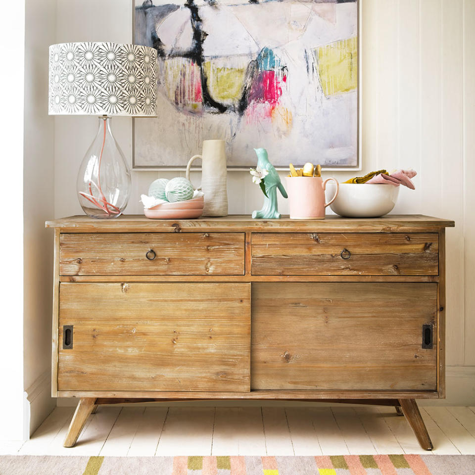 Living room sideboard with glass lamp and patterned lamp shade