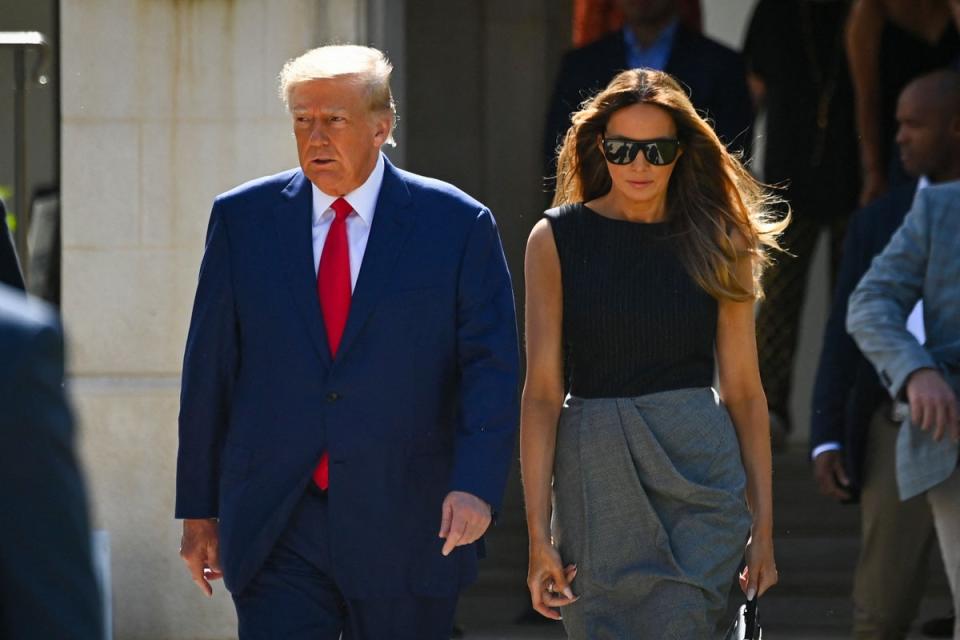 Donald and Melania Trump leave a polling station after voting in the US midterm elections in Palm Beach, Florida, on November 8, 2022 (AFP via Getty Images)