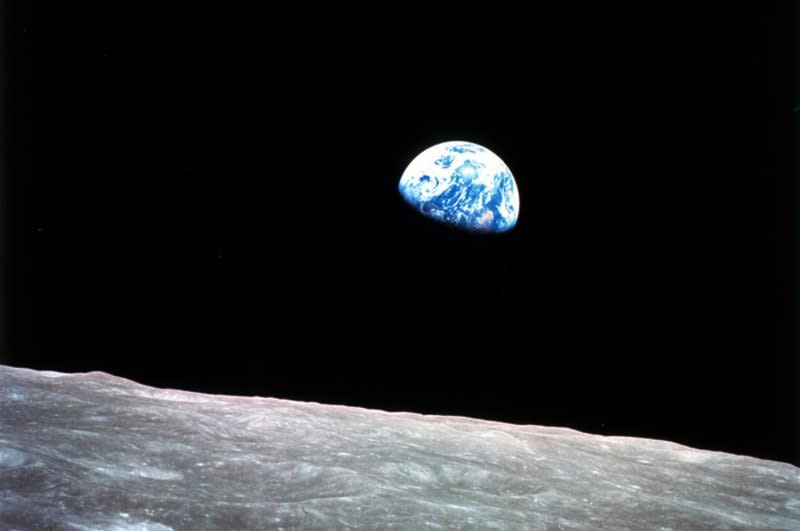 This photo of "Earthrise" over the lunar horizon was taken by the Apollo 8 crew in December 1968, showing Earth for the first time as it appears from deep space. Photo courtesy of NASA