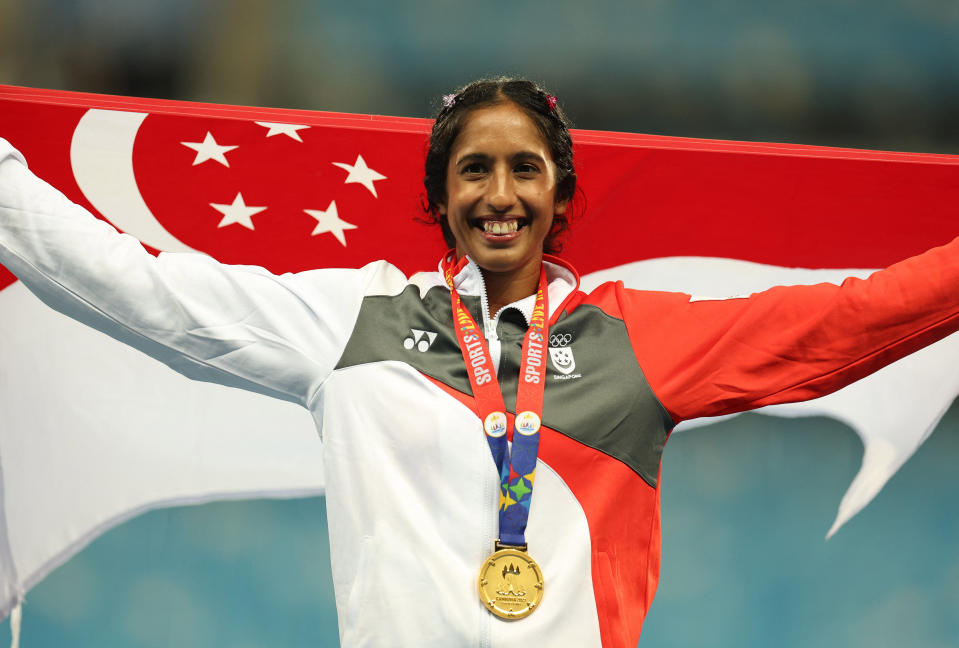 Singapore sprinter Shanti Pereira celebrates winning the gold medal in the women's 100mm at the 2023 SEA Games.