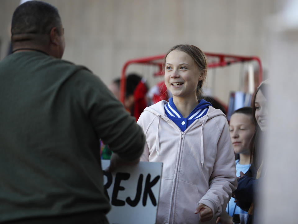 Swedish climate activist Greta Thunberg greets a well-wisher after she spoke to several thousand people at a climate strike rally Friday, Oct. 11, 2019, in Denver. The rally was staged in Denver's Civic Center Park. (AP Photo/David Zalubowski)