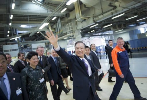 Chinese Prime Minister Wen Jiabao waves to employees at the Volvo car factory in Gothenburg, Sweden, on April 24. China invested a modest $821 million in Poland between 2004-10 with annual averages doubling in recent years, according to a report by the Central & Eastern Europe Development Institute