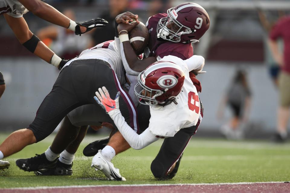 Bearden’s Kai Ironside (9) forces his way into the end zone for a touchdown against Oak Ridge.