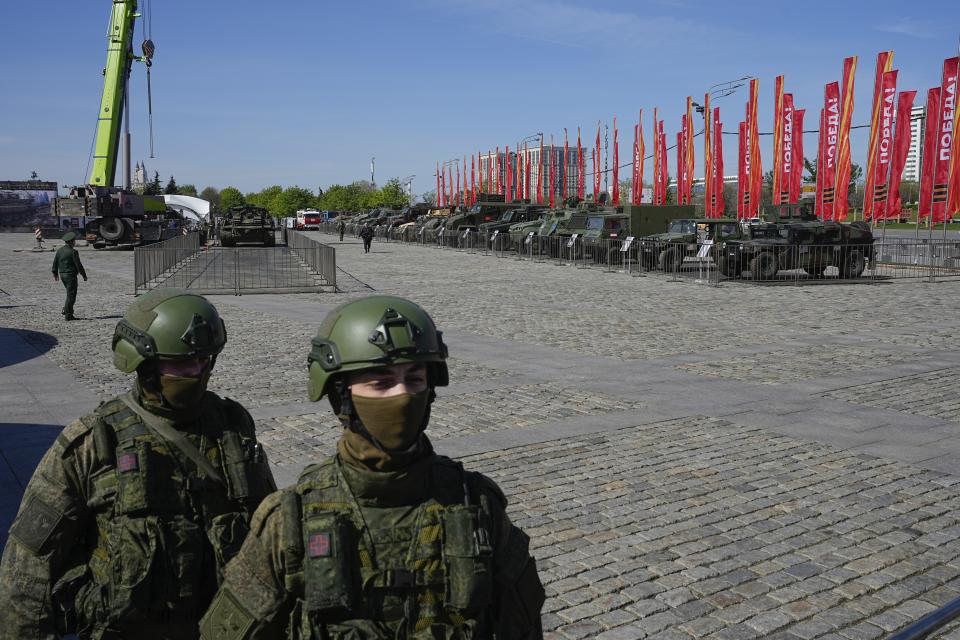 Russian soldiers guard an area with armoured military vehicles that belonged to the Ukrainian army on display in Moscow, Tuesday, April 30, 2024. The Russian military put some of the equipment captured from Ukrainian forces on display in Moscow. (AP Photo/Alexander Zemlianichenko)