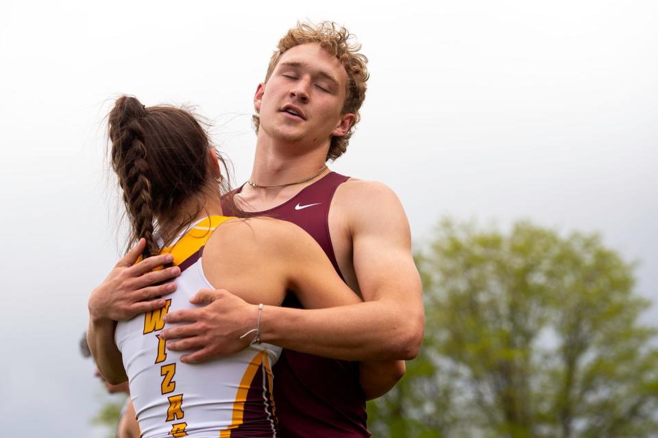 Windsor's Mikey Munn embraces Kiana Cumings after he finishes his final race during the Colorado track & field state championships on Saturday, May 17, 2024 at Jeffco Stadium in Lakewood, Colo.