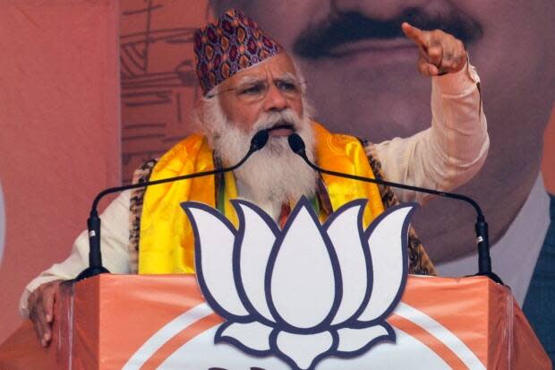 Modi gestures as he speaks at a rally during the ongoing Phase 4 of West Bengal's assembly election on April 10. 