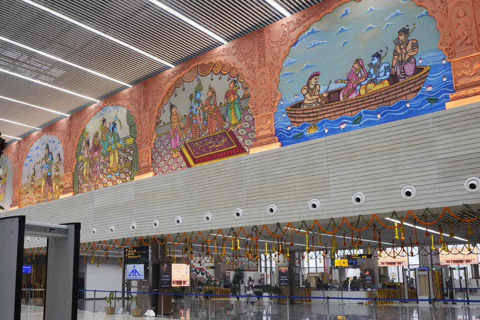 FILE - The newly built Maharishi Valmiki International Airport is decorated the day before it is scheduled to be inaugurated by Prime Minister Narendra Modi in Ayodhya, India, Dec. 29, 2023. The city, once known for its narrow lanes crowded with Hindu monks and pilgrims thronging street shops selling miniature idols of Ram, has been given a complete facelift with modern infrastructure and state-of the art services for visitors. Ayodhya’s modest airstrip has grown into an expansive international airport with a 2200-meter runway in the first phase. (AP Photo/Rajesh Kumar Singh, File)
