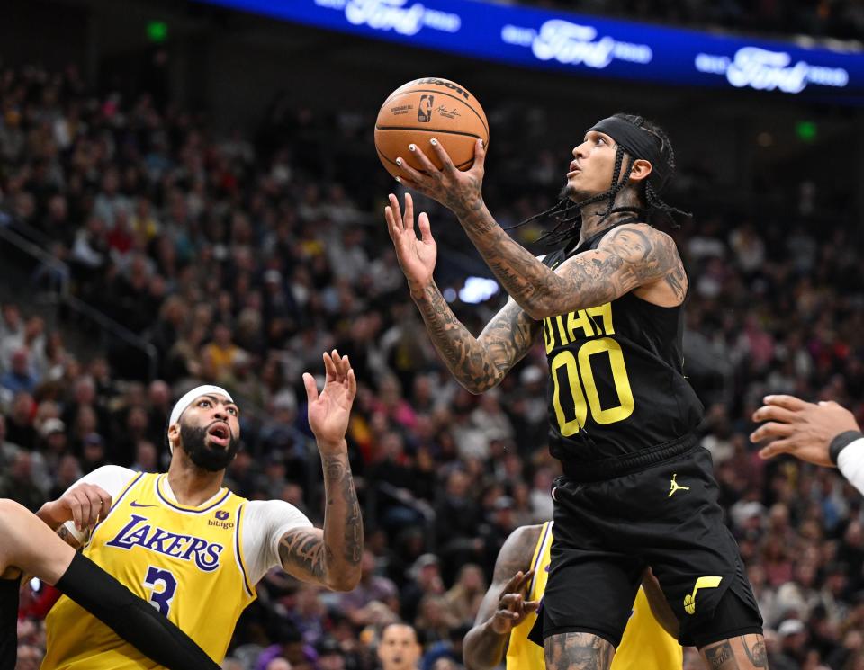 Utah Jazz guard Jordan Clarkson (00) goes up for a shot with Los Angeles Lakers forward Anthony Davis (3) trying the defend as the Utah Jazz and the Los Angeles Lakers play at the Delta Center in Salt Lake City on Wednesday, Feb. 14, 2024. | Scott G Winterton, Deseret News