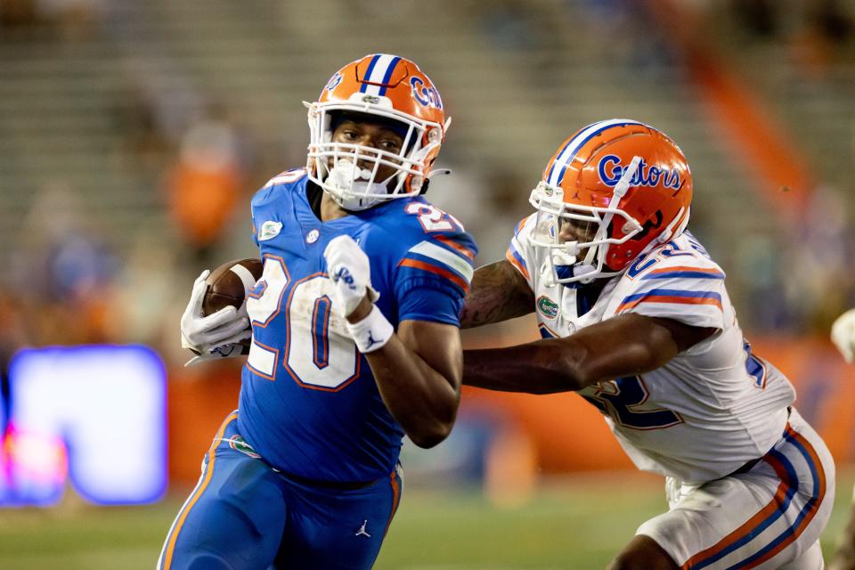 Florida running back Treyaun Webb (20) rushes for yardage during the second half of the Orange and Blue game on April 13.