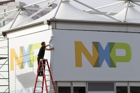 A man works on a tent for NXP Semiconductors in preparation for the 2015 International Consumer Electronics Show (CES) at Las Vegas Convention Center in Las Vegas, Nevada January 4, 2015. REUTERS/Steve Marcus