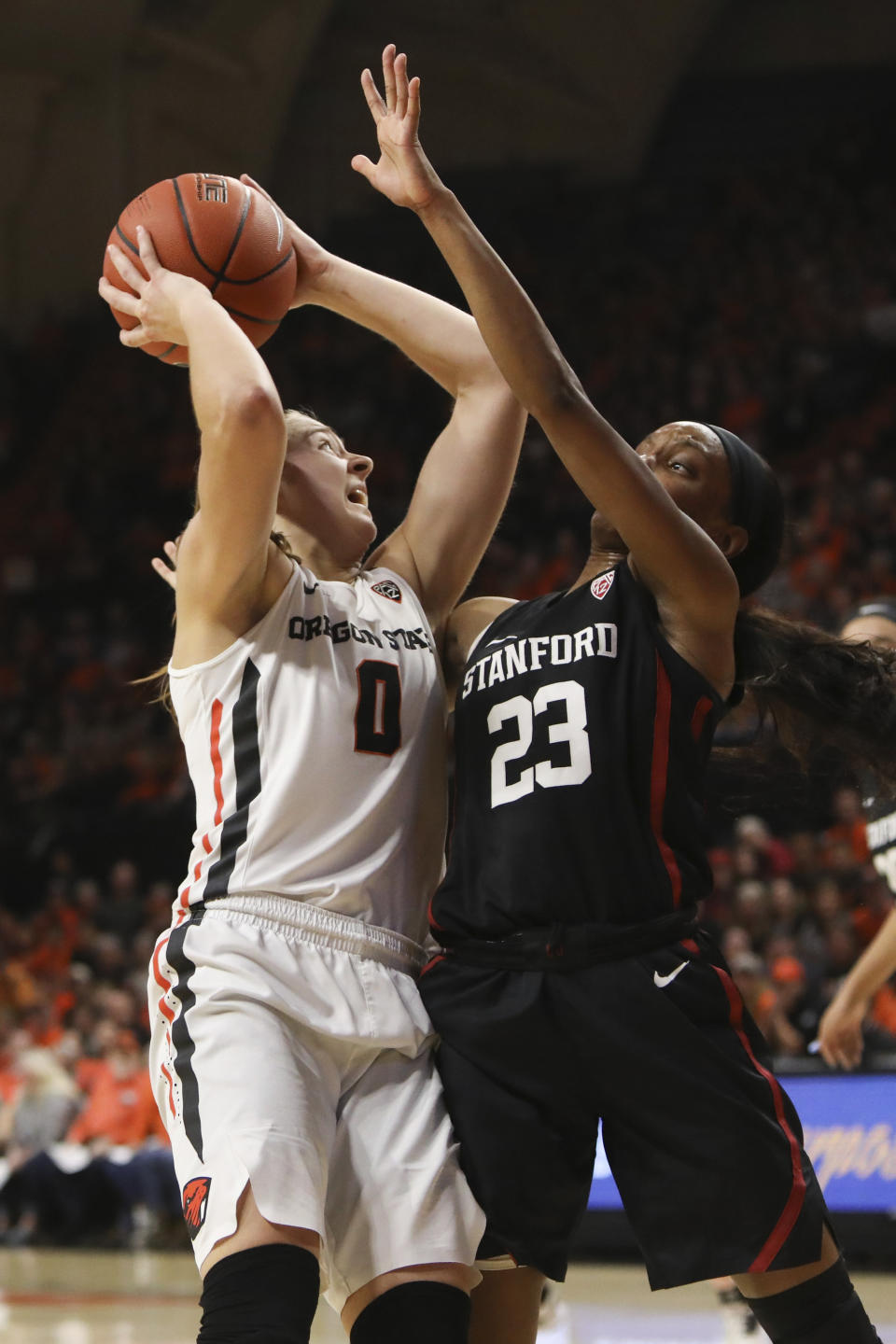 Stanford's Kiana Williams (23) defends against Oregon State's Mikayla Pivec (0) during the second half of an NCAA college basketball game in Corvallis, Ore., Sunday, Jan. 19, 2020. (AP Photo/Amanda Loman)