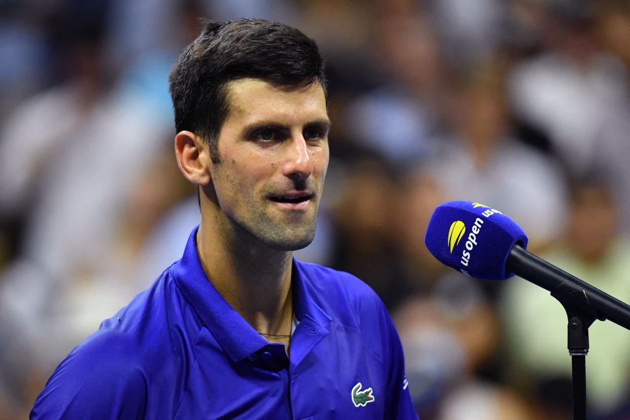 Serbia's Novak Djokovic speaks on the court after winning his 2021 US Open Tennis tournament men's singles first round match against Denmark's Holger Rune at the USTA Billie Jean King National Tennis Center in New York, on August 31, 2021. (Photo by ANGELA  WEISS / AFP) (Photo by ANGELA  WEISS/AFP via Getty Images)