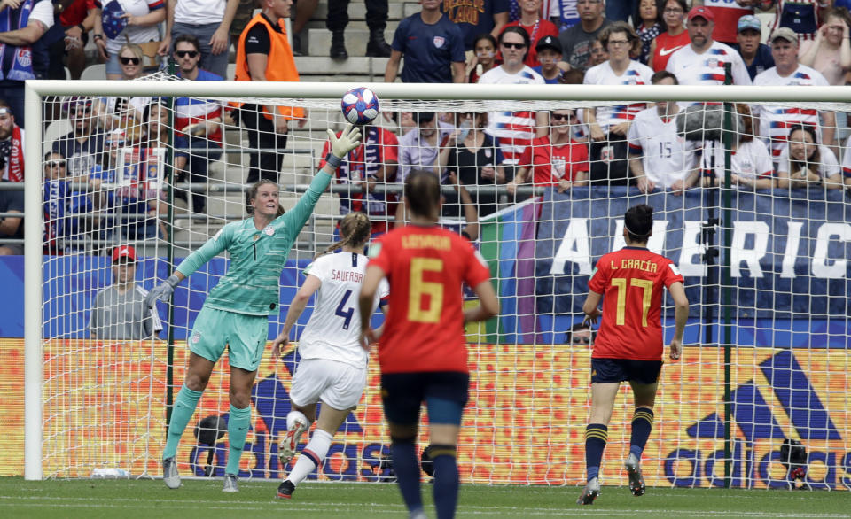 United States goalkeeper Alyssa Naeher, left, fails to stop a goal shot by Spain's Jennifer Hermosoduring the Women's World Cup round of 16 soccer match between Spain and US at the Stade Auguste-Delaune in Reims, France, Monday, June 24, 2019. (AP Photo/Alessandra Tarantino)