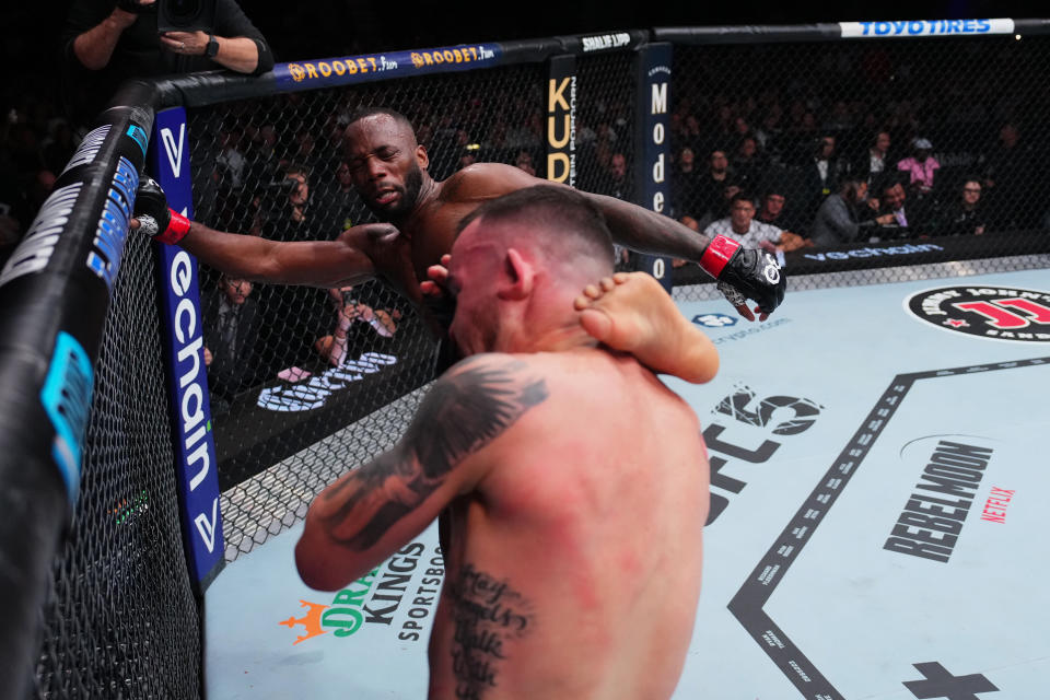 LAS VEGAS, NEVADA - DECEMBER 16: (L-R) Leon Edwards of Jamaica kicks Colby Covington in the UFC welterweight championship fight during the UFC 296 event at T-Mobile Arena on December 16, 2023 in Las Vegas, Nevada. (Photo by Jeff Bottari/Zuffa LLC via Getty Images)