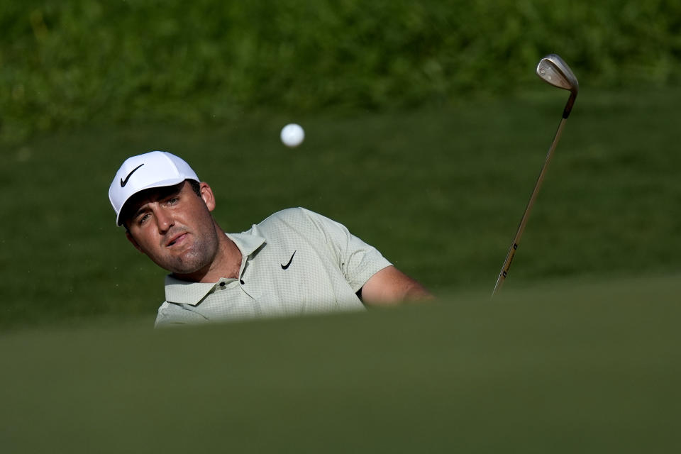 Scottie Scheffler chips onto the 14th green during the first round of The Sentry golf event, Thursday, Jan. 4, 2024, at Kapalua Plantation Course in Kapalua, Hawaii. (AP Photo/Matt York)