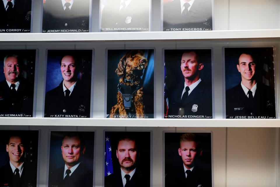 A photo of De Pere Fire Rescue's therapy dog, Stanley, is displayed among other staff members at the station.