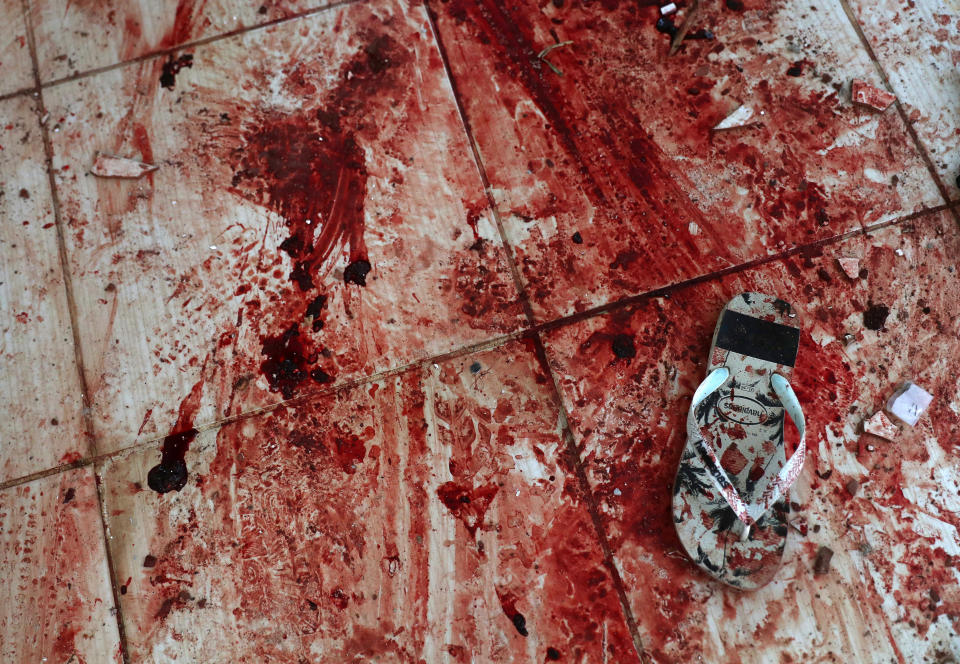 Blood stains the floor of a home near Rio's Santa Teresa neighborhood. Local residents say police killed at least 13 people in a Feb. 9, 2019, operation, including some who were shot execution-style inside the home. (Photo: Pilar Olivares / Reuters)