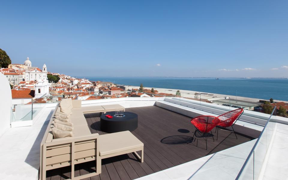 From its sleek terrace with inset pool, the Memmo Alfama possesses some of the best views of Lisbon's characteristic church spires and red rooftops