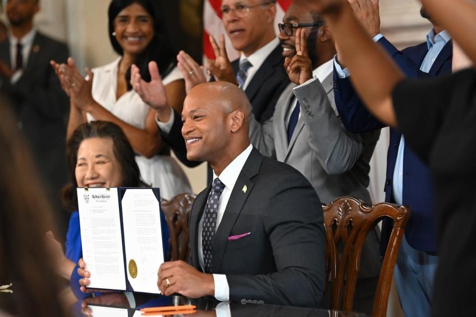 Gov. Wes Moore celebrates with attendees after signing a historic executive order pardoning 175,000 Maryland convictions related to the possession of cannabis, including convictions for misdemeanor possession of cannabis and certain convictions for misdemeanor possession of drug paraphernalia.