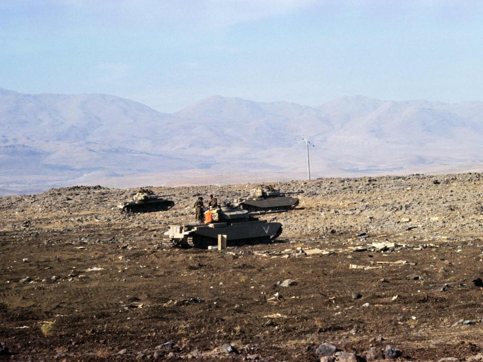 Israeli tanks positioned near the Syrian frontline on the Golan Heights