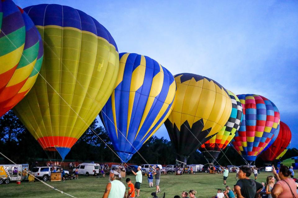 Hot air balloons are inflated in August during the FireLake Fireflight Balloon Festival in Shawnee.