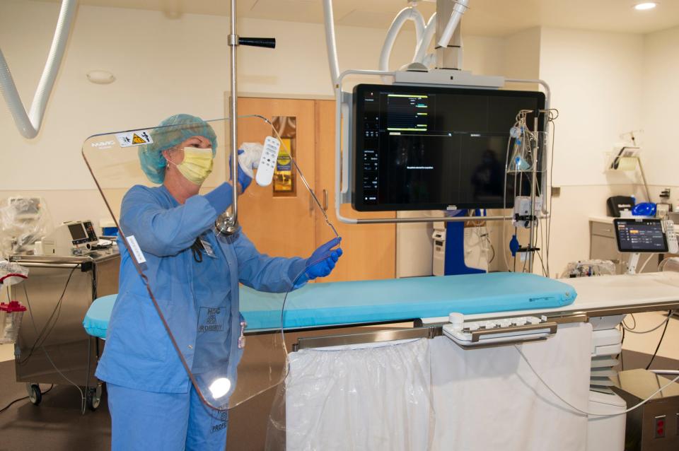 Staff cleans the cath lab at Community Medical Center in Toms River.