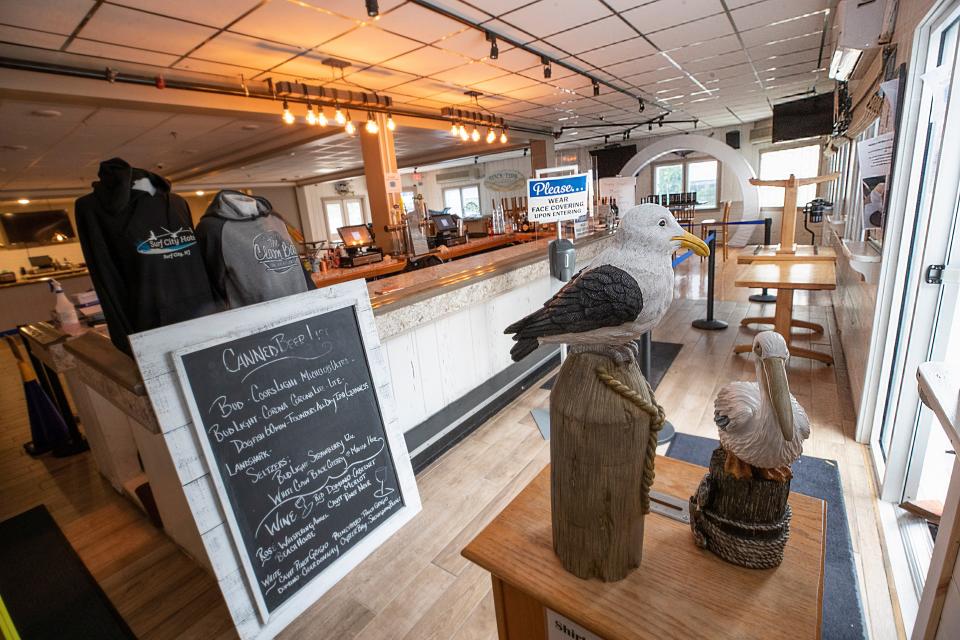 Facemasks are required after entering the bar or dining area at the Surf City Hotel in Surf City. Besides renting rooms, the hotel also serves food, has a liquor store and contains two bars. The hotel has both inside and outside eating and drinking areas which have become popular, especially in this time of the pandemic.