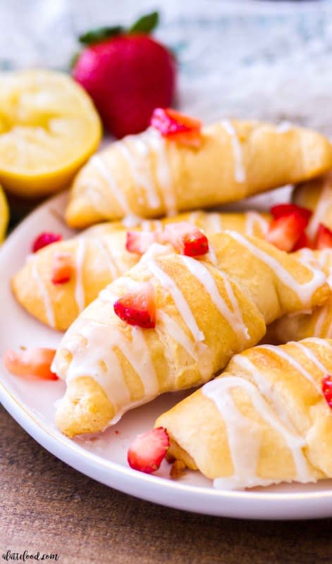 <p>These easy strawberry lemon cheesecake croissants (aka strawberry lemon cheesecake crescent rolls) are made with just 6 ingredients!</p><p><strong>Get the recipe: <a href="https://www.alattefood.com/strawberry-lemon-cheesecake-croissants/" rel="nofollow noopener" target="_blank" data-ylk="slk:Strawberry Lemon Cheesecake Croissants;elm:context_link;itc:0;sec:content-canvas" class="link rapid-noclick-resp"><em>Strawberry Lemon Cheesecake Croissants</em></a></strong></p>