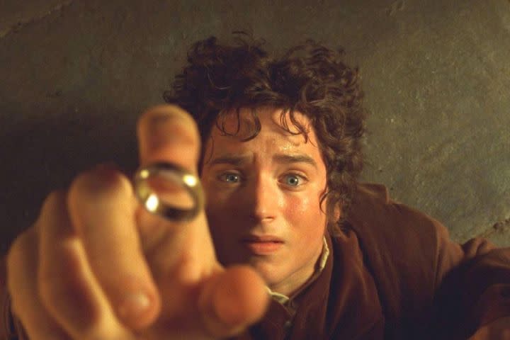 Elijah Wood as Frodo Baggins reaching out for the One Ring in The Lord of the Rings- The Fellowship of the Ring