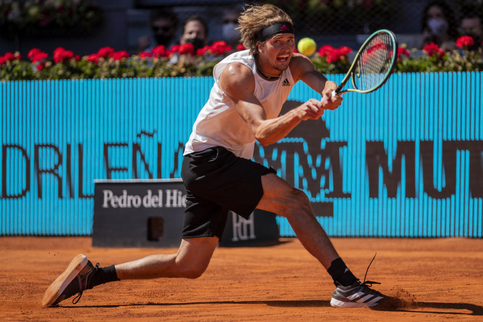 Germany's Alexander Zverev returns the ball to Spain's Rafael Nadal during their match at the Mutua Madrid Open tennis tournament in Madrid, Spain, Friday, May 7, 2021. (AP Photo/Bernat Armangue)