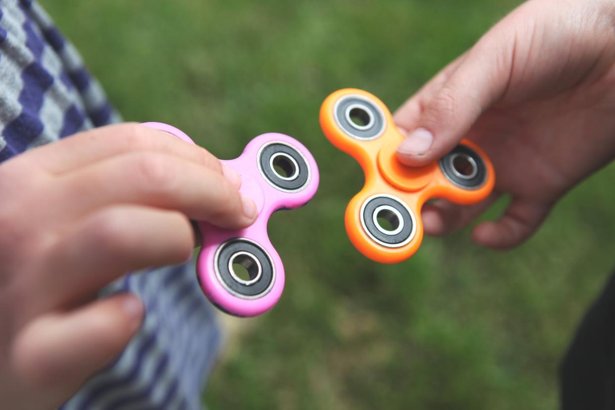 Two fidget spinners