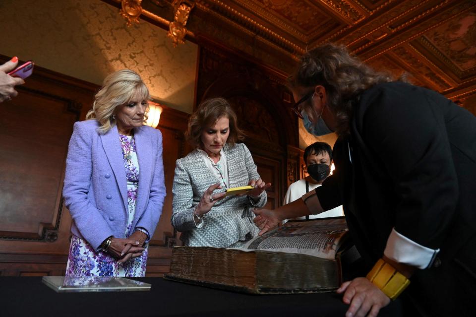 Dr. Beatriz Gutierrez Muller (2R), first lady of Mexico, uses her phone to record the explanation of a specialist as she and first lady Jill Biden tour of the Library of Congress in Washington, DC on July 12, 2022.