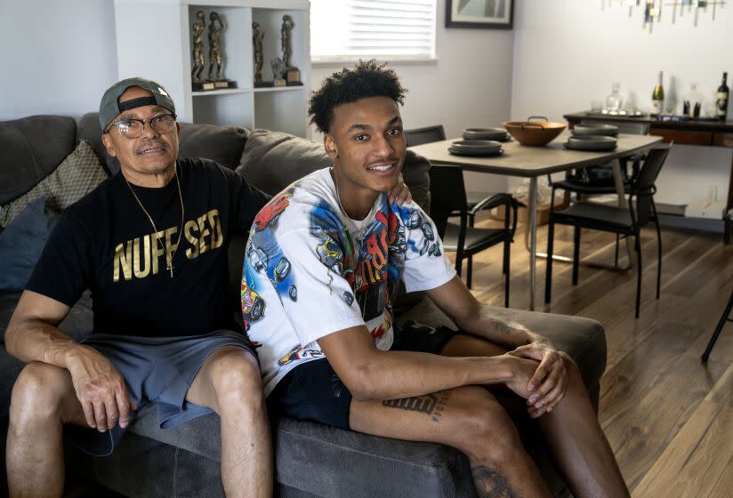 LAS VEGAS, NV - JULY 11, 2023: Lakers rookie Maxwell Lewis, right, spends time with his dad Robert Lewis.