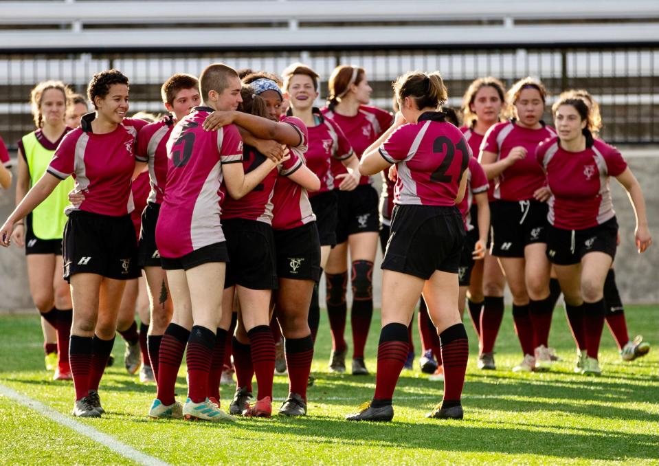 The Vassar College women's rugby team celebrates after beating Temple University in the American Collegiate Rugby Association Championship game on Dec. 4, 2021.