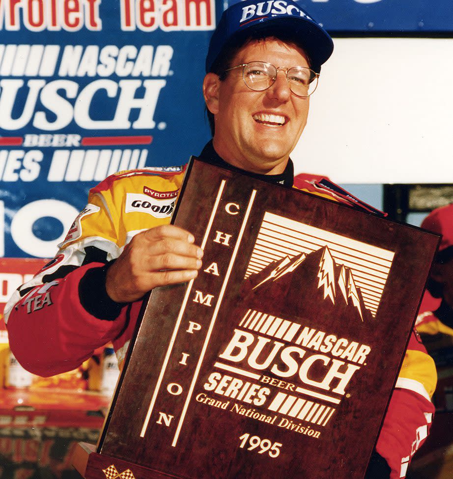 1995: Johnny Benson, Jr. celebrates his NASCAR Busch Grand National championship. Benson won two races on his way to the title, driving Chevrolets owned by Bill Baumgardner. (Photo by ISC Images & Archives via Getty Images)