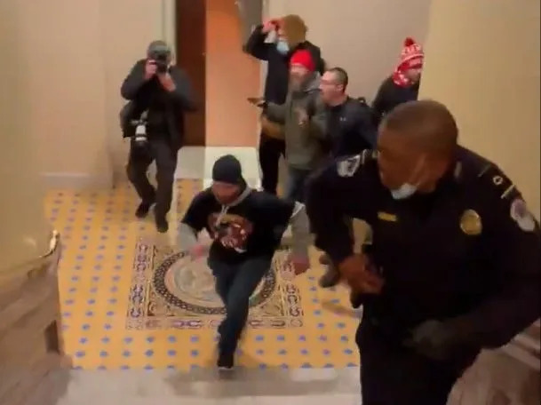 Video shows Doug Jensen leading a pack of men chasing Capitol Police Officer Eugene Goodman through the US Capitol on January 6.