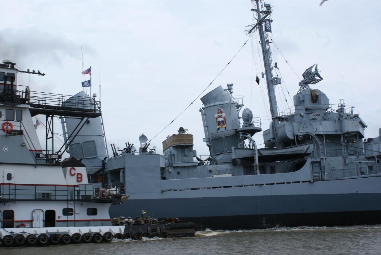 The U.S.S. Kidd ferried through the Houma Navigational Canal, May 2. It is being towed to Thoma-Sea Marina for repairs.