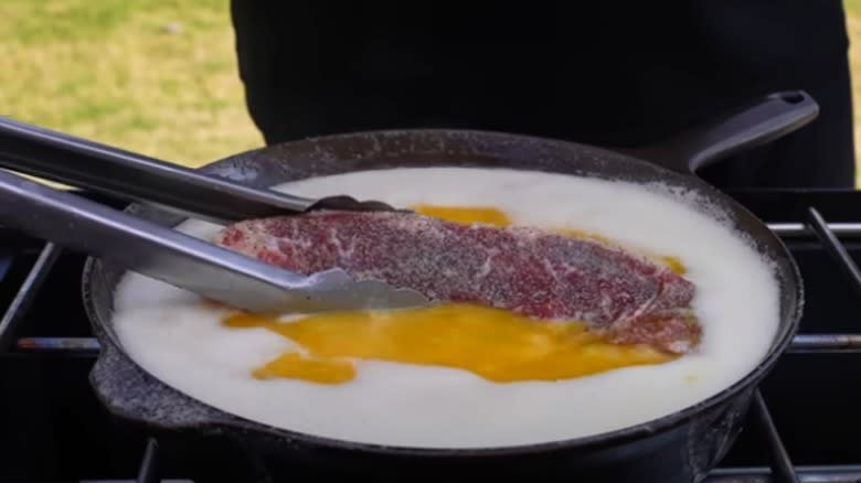 deep-frying steak in Papa John's garlic sauce