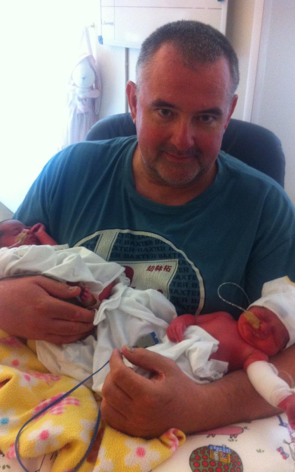 Paul with twin daughters Caitlin and Leila