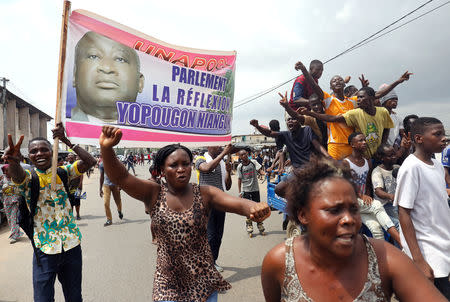 Supporters of former Ivory Coast President Laurent Gbagbo celebrate along a street in Abidjan’s Yopougon neighborhood, Ivory Coast January 15, 2019. REUTERS/Luc Gnago