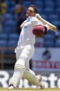 West Indies' Joshua Da Silva celebrates after he scored a century against England during day three of their third Test cricket match at the National Cricket Stadium in St. George, Grenada, Saturday, March 26, 2022. (AP Photo/Ricardo Mazalan)