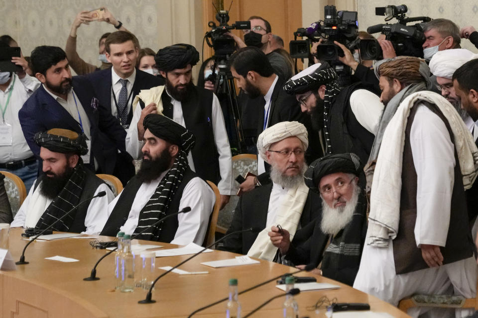 Taliban official Abdul Salam Hanafi, center, and other members of the political delegation from the Afghan Taliban's movement arrive to attend the talks involving Afghan representatives in Moscow, Russia, Wednesday, Oct. 20, 2021. Russia invited the Taliban and other Afghan parties for talks voicing hope they will help encourage discussions and tackle Afghanistan's challenges. (AP Photo/Alexander Zemlianichenko, Pool)