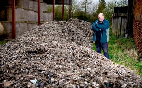 Andrew Nicholls, a farmer in Bridgnorth, Shropshire, has installed floodlights and reinforced concrete gates after 100 tons of waste was dumped on his farm - Credit:  Jamie Ricketts/Caters News