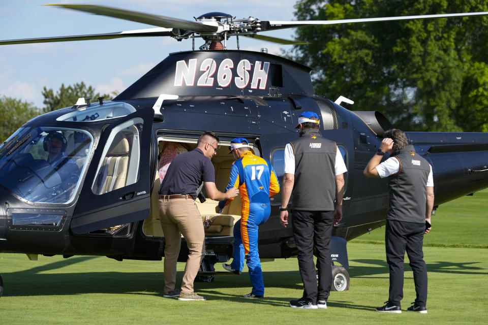 Kyle Larson boards a helicopter after qualifying for the Indianapolis 500 auto race at Indianapolis Motor Speedway in Indianapolis, Sunday, May 19, 2024. (AP Photo/Michael Conroy)