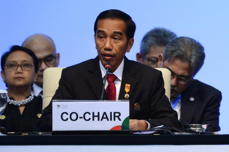 Indonesian President Joko Widodo (C) delivers his closing statement during the closing ceremony of the Asian African Conference in Jakarta on April 23, 2015