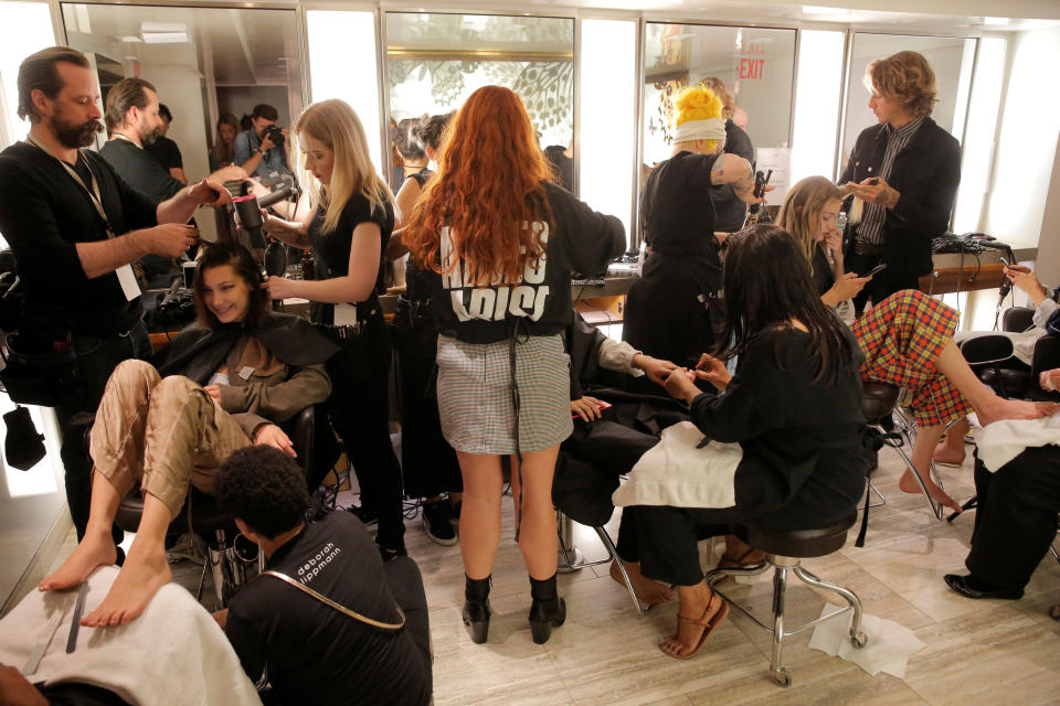 Models Bella Hadid and Gigi Hadid are prepared backstage before walking in the Brandon Maxwell Spring/Summer 2018 collection presentation at New York Fashion Week in Manhattan, New York, U.S., September 8, 2017.  REUTERS/Andrew Kelly