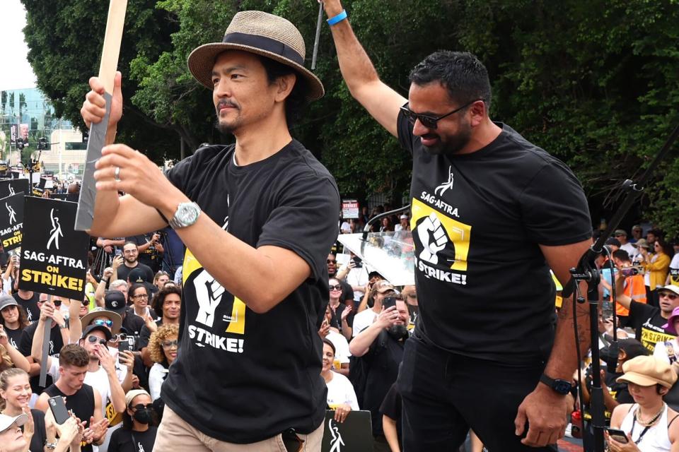 John Cho and Kal Penn at a SAG-AFTRA strike rally