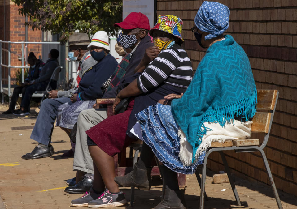 Retirees wait to receive a first dose of the Pfizer coronavirus vaccine in a tent during a mass vaccination program for the elderly at a clinic outside Johannesburg, South Africa, Monday, May 24, 2021. South Africa aims to vaccinate 5 million of its older citizens by the end of June. (AP Photo/Themba Hadebe)