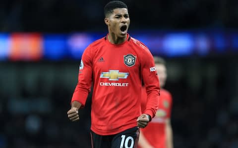 Marcus Rashford of Man Utd celebrates victory over Manchester City - Credit: Getty Images