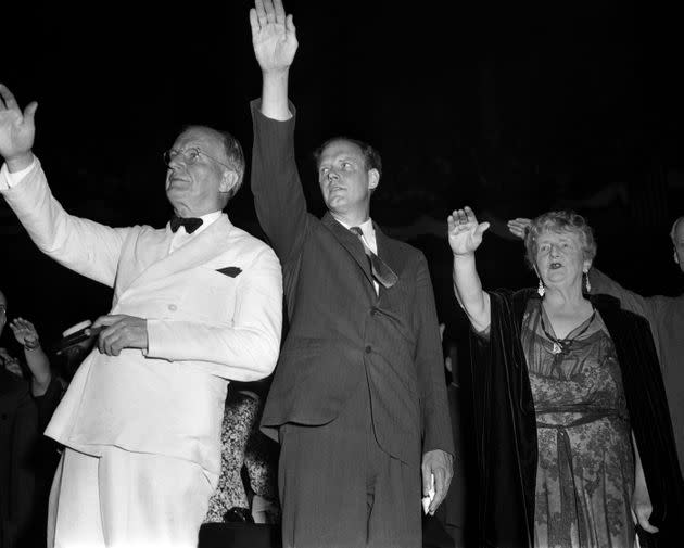 Sen. Burton K. Wheeler, left, aviator Charles Lindbergh and novelist Kathleen Norris pledge allegiance to the flag at an America First Committee rally in New York City on May 23, 1941. They are giving the Bellamy Salute, which was replaced by the hand-over-heart gesture the following year because it resembled the Nazi and fascist salutes in Italy and Germany. The AFC was a pressure group opposed to U.S. involvement in World War II. (Photo: Irving Haberman/IH Images via Getty Images)